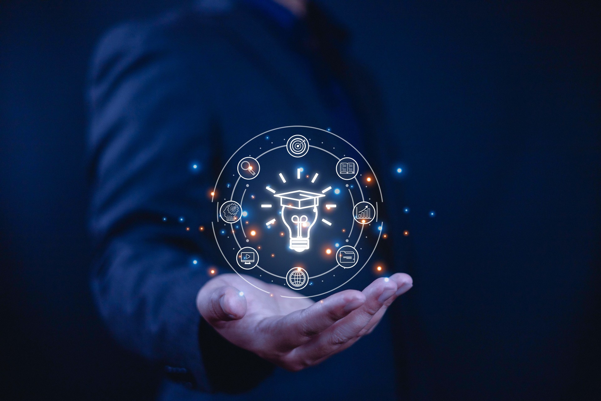 E-learning concept, Businessman showing e-learning icons on hand. Learning online educate technology provides easy access, Learning through online greater enhance. training digital online